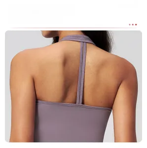 Macro shot of purple yoga sports bra with criss-cross back straps and matte texture