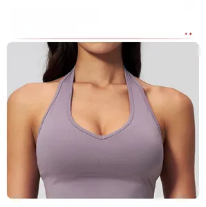 Detail of the V-neckline and halter strap on a purple high-stretch yoga sports bra