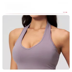 Close-up of lilac halter neck sports bra featuring removable pads and V-neckline