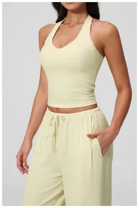 Detail of V-neck brushed yoga tank top in cream yellow with soft knitted texture