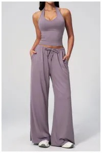 Detail of soft brushed purple yoga set featuring a halter crop top and drawstring pants