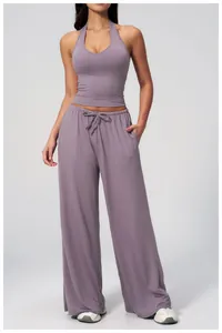 Full view of mauve yoga set featuring halter back top and drawstring wide-leg pants