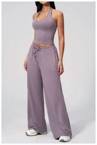 Close-up of Morandi purple yoga set featuring a halter crop top and wide-leg trousers