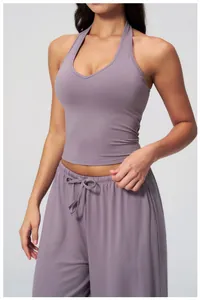 Close-up of v-neck yoga vest and matching drawstring pants in purple-gray brushed fabric