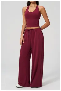 Macro detail of the wine red halter neck sports top and drawstring wide leg pants