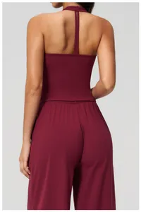 Rear view of burgundy yoga set featuring halter backless top and high-waisted pants