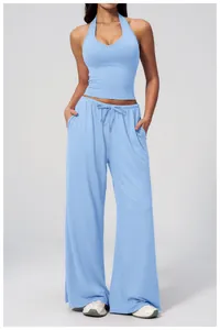 Close-up of light blue yoga top with V-neckline and breathable knitted texture
