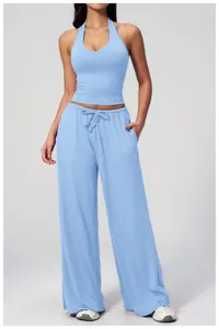 Detail of light blue brushed yoga set with V-neck halter top and wide leg pants