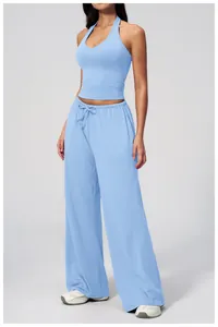 Detail of the high-waisted wide-leg trousers with adjustable drawstring on the waist