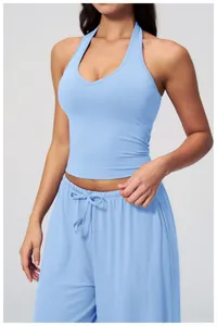 Detail of light blue brushed yoga set featuring halter neck top and drawstring pants