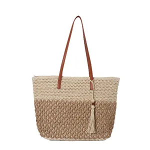 Bohemian patchwork straw tote bag with brown straps and tassel for beach vacations