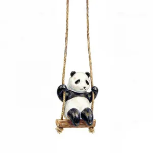 Detailed close-up of cute panda figurine swinging on a rope with realistic fur texture