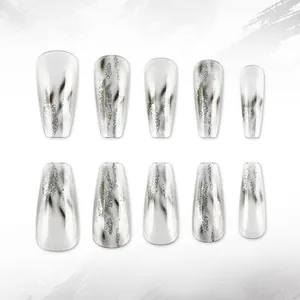 Silver glitter cat eye press-on nails with black flame patterns in coffin shape