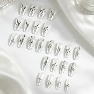Detail of silver metallic coffin nails with black flame patterns on white silk