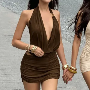 Detail of coffee brown ruched halter dress with deep V-neck and gold metal ring link