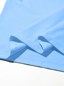 Detailed view of sky blue knit hem with precise double needle stitching and serged inner edges