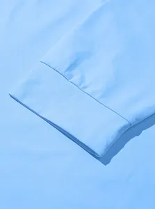 Close-up of light blue hoodie ribbed cuffs with high-density twill cotton texture