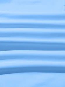 Detail of light blue twill fabric with soft texture and natural drapes for men's hoodie