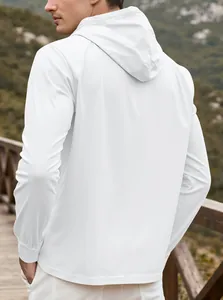 Close-up of white men's hooded sweatshirt with premium twill texture and button detail