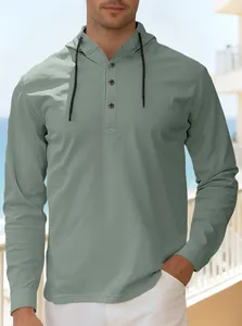 Detail of men's sage green cotton blend hoodie with buttoned placket and drawstring