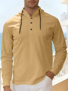 Detail of mustard yellow hoodie with Henley neck, three buttons, and adjustable drawstrings