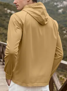 Outdoor back view of men's khaki windproof hooded jacket in a scenic landscape