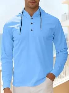 Detail of light blue men's hooded henley shirt with three buttons and black drawstrings