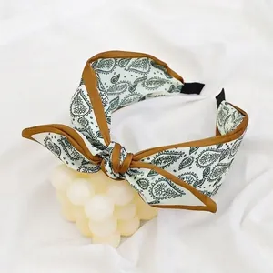 Beige paisley wide headband with retro bow knot and brown border detail for women