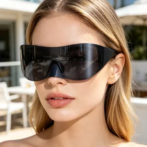 Close-up of oversized black shield sunglasses on a model for outdoor cycling