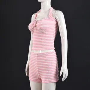 Detail of pink and white striped knit texture on two-piece halter top and shorts set