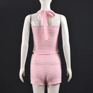 Close-up of pink and white striped knit backless halter top and matching shorts set
