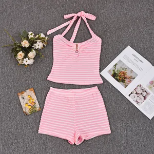 Detailed view of pink striped halter top with metal ring and matching shorts set