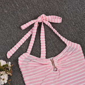 Close-up of pink and white striped halter top with central O-ring and tie-back closure
