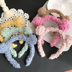 Detail of plush lamb wool headbands in various soft pastel colors and textures