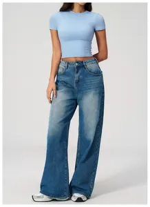 Detailed shot of a light blue quick-dry fitness t-shirt paired with retro wide-leg jeans