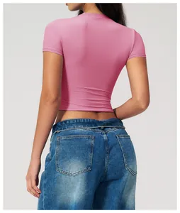 Slim fit pink short sleeve crop top for fitness and yoga, back view of the athletic fabric