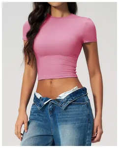 Close-up of pink slim fit crop top showing high-stretch fabric and crew neckline