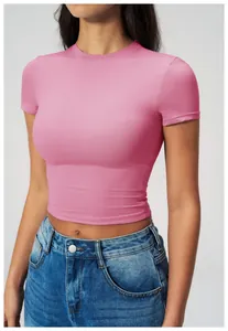 Close-up of slim fit pink crop top with crew neck and breathable athletic fabric