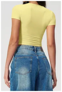 Back view of a slim-fit quick-dry yoga t-shirt paired with high-waist denim jeans
