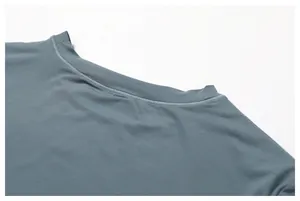 Close-up of double-stitched round neckline on grey-blue quick-dry fitness t-shirt