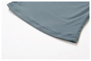 Close-up of the double-needle stitched hem on a breathable blue-grey athletic t-shirt