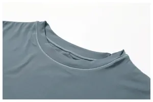 Close-up of blue-grey athletic T-shirt showing crew neck and double-needle stitching