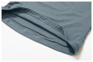 Close-up of double-needle coverstitch hem on quick-dry slim fit yoga sports t-shirt