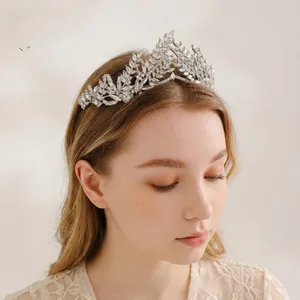 Close-up of Baroque silver olive branch tiara with rhinestones on a blonde model