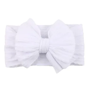 Soft white elastic baby headband with large jacquard bow for newborns and infants