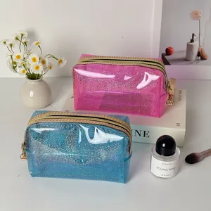 Glitzernde transparente PVC-Kosmetiktaschen in Rosa und Blau mit Goldreißverschluss