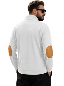Detail of corduroy texture and brown elbow patches on a men's white long sleeve shirt
