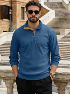 Close-up of men's blue corduroy Henley shirt with yellow elbow patches and buttons
