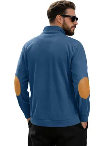 Detail of dark blue corduroy pullover featuring brown faux-leather elbow patches