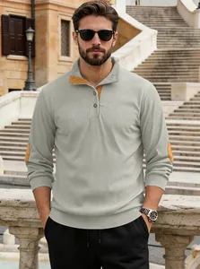 Detail of grey corduroy sweatshirt with yellow suede patches on elbows and neck
